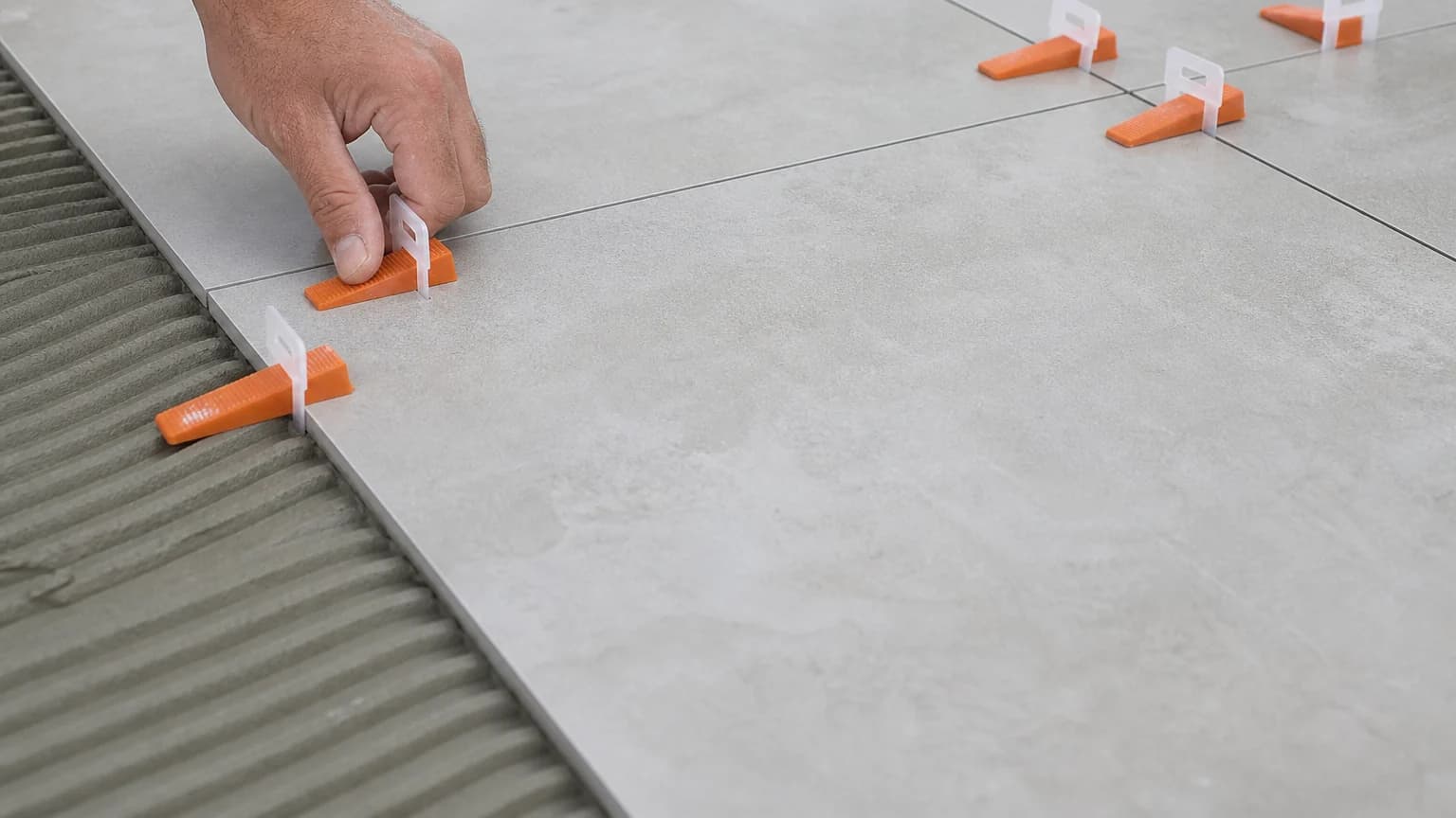 Tokoz TLS tile leveling clips and wedges in use Tokoz TLS tile leveling clips and wedges in use